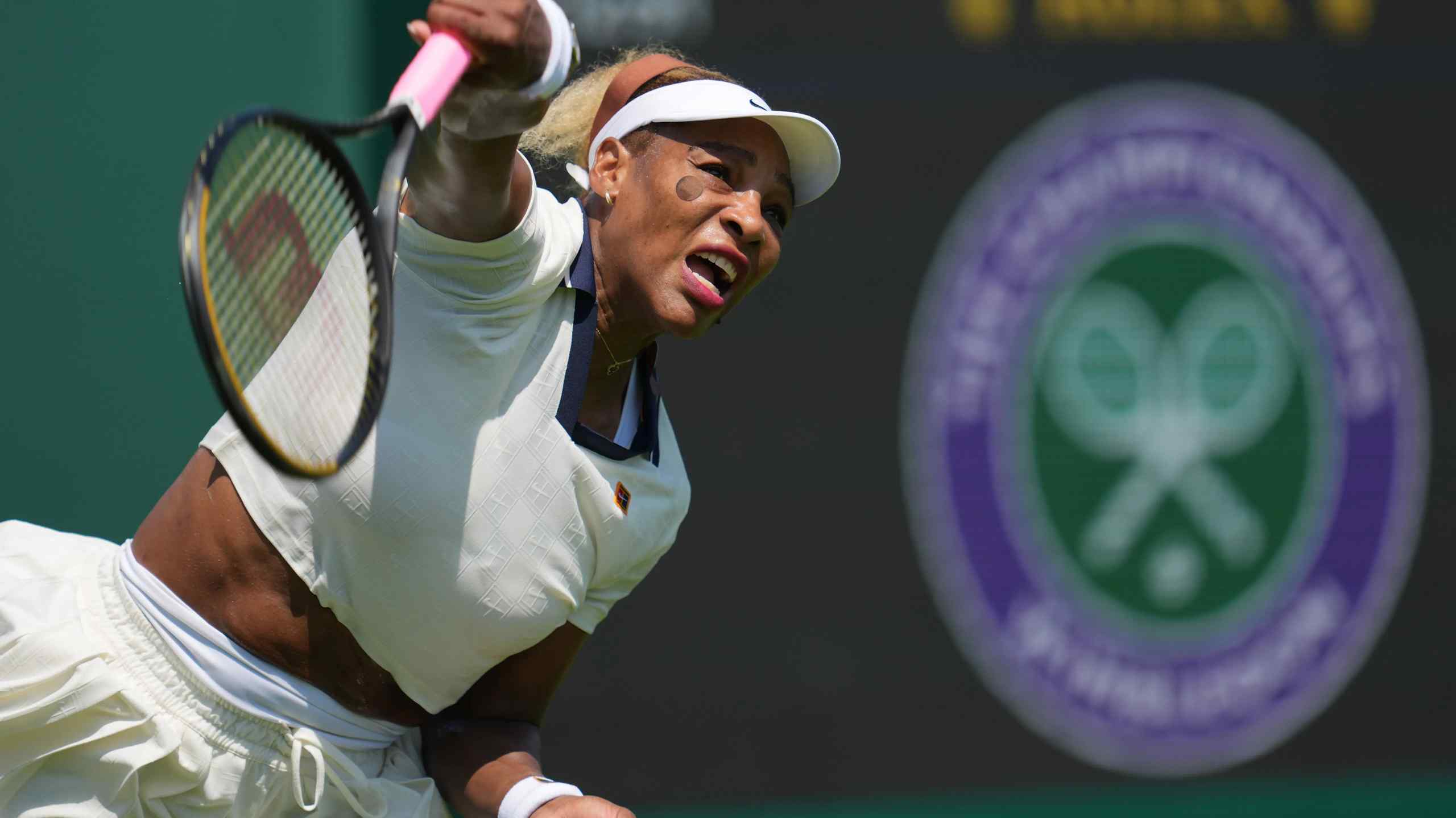 Serena Williams swings a tennis racket.